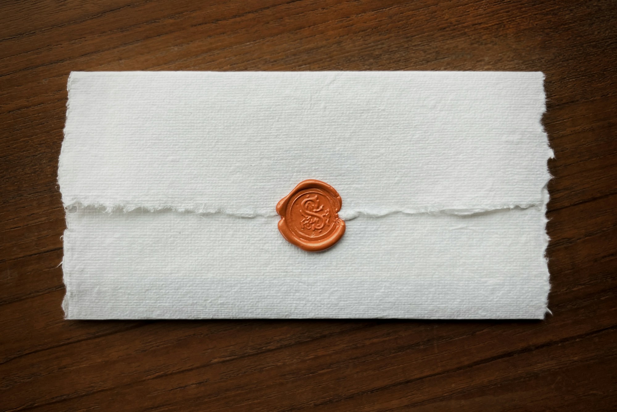 Official wax seal on a document, close up on the paper texture
