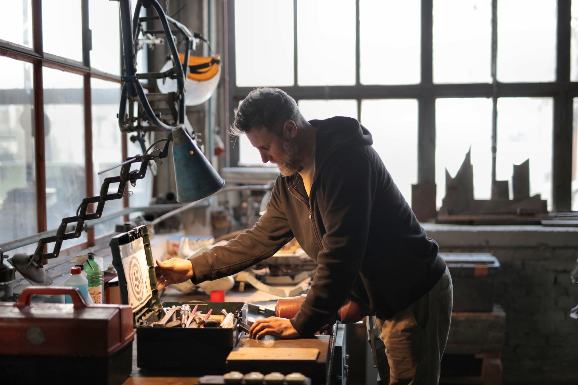 An SME owner at his workbench, in his workshop